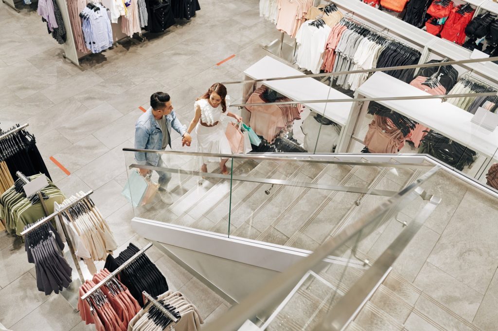 couple-making-purchases-in-mall-e1620293950493.jpg